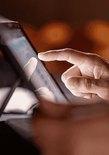 Investor checking markets on smartphone